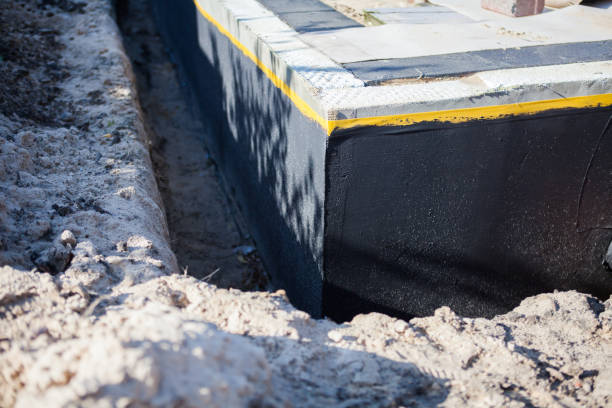 Professional Waterproofing technician working in Long Beach, NY